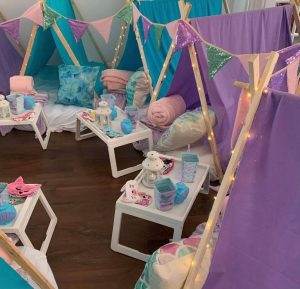 Purple and blue mermaid themed teepees with table trays and mattresses