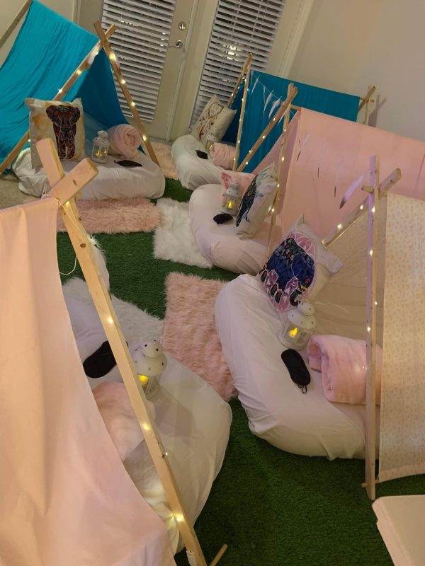 Slumberr Party with small teepees and fairy light decorations