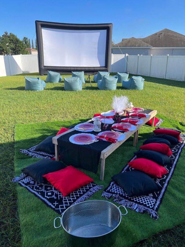 Stranger things theme glamping luxury picnic with 25' big screen in the background
