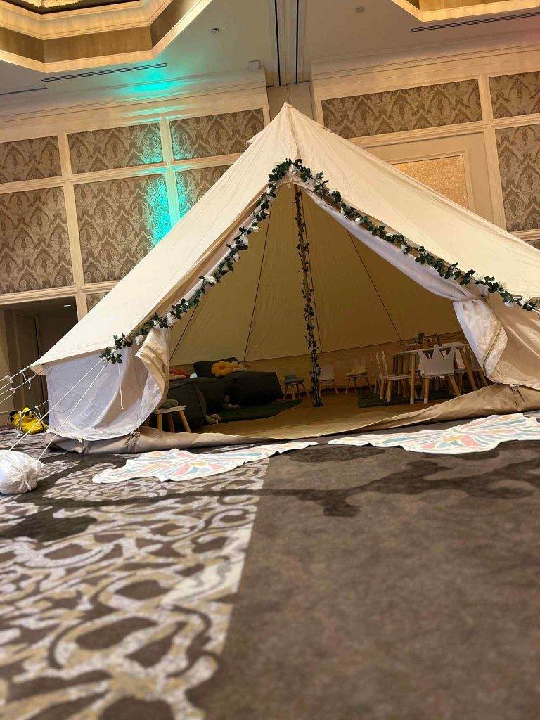 Bell tent setup inside of a gymnasium for close encounters with actors and actresses.
