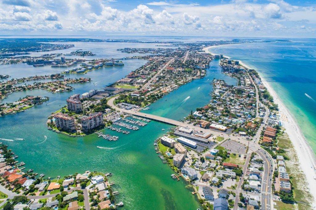 An aerial view of the city of Sarasota, Florida, showcasing its beautiful skyline and vibrant urban landscape.
