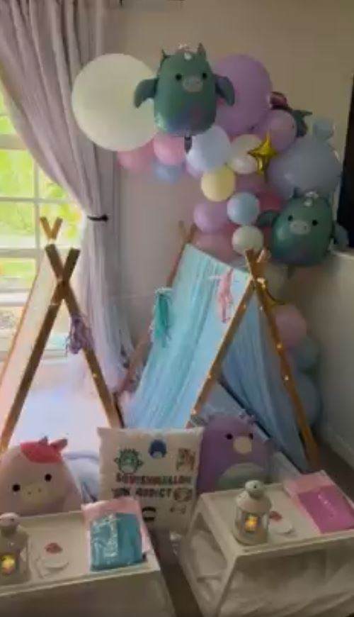 A Lakeland-themed baby's room with a Balloon Garland and a teepee designed to create a festive party atmosphere. The addition of a bell tent adds a cozy and enchanting touch to the space.