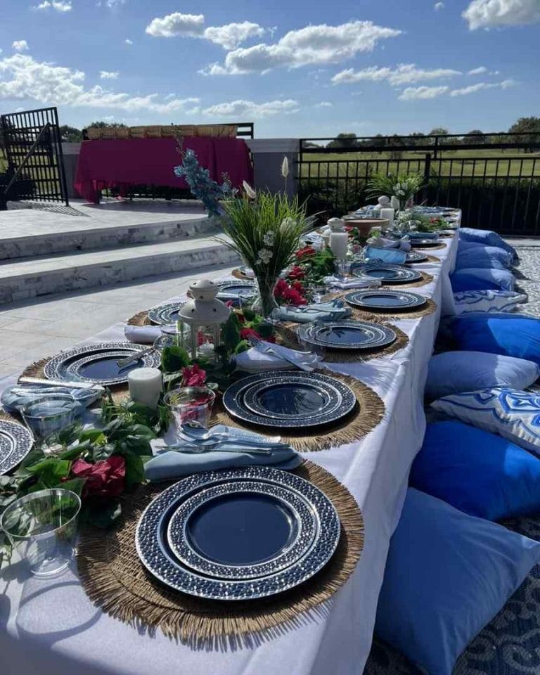 A table set with blue and white plates for a party.