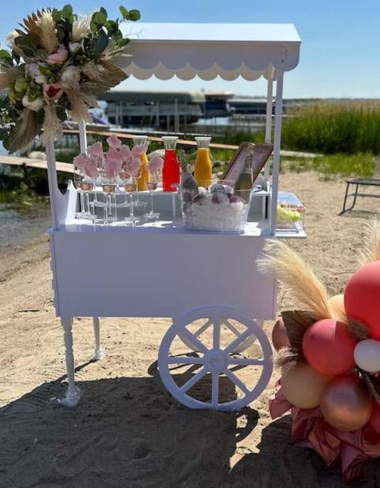 A party Elegant White Snack or Candy Cart Rental on the beach.