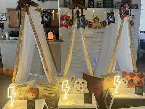Three indoor tents decorated with Harry Potter-themed banners and pillows set the stage for a Harry Potter Themed Party. Each tent has a small table in front adorned with glowing lightning bolt lights and various Harry Potter items, creating an enchanting experience for fans of all ages. 1 Three indoor tents decorated with Harry Potter-themed banners and pillows set the stage for a Harry Potter Themed Party. Each tent has a small table in front adorned with glowing lightning bolt lights and various Harry Potter items, creating an enchanting experience for fans of all ages.