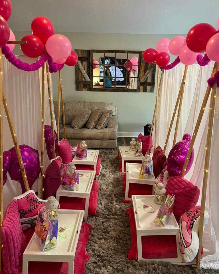 Step into a whimsical party wonderland, where charming teepees take center stage amidst a vibrant sea of pink and red balloons that dance overhead. Soft, plush pillows invite guests to relax around intimate, low-set tables adorned with elegant lanterns emitting a warm glow. Each table is thoughtfully decorated to enhance the festive atmosphere. Eye-catching gift bags sit ready for delighted partygoers, adding an extra touch of excitement and anticipation. Ideal for children's birthday celebrations or memorable gatherings, this enchanting room setup is designed to captivate and inspire magic-filled moments.