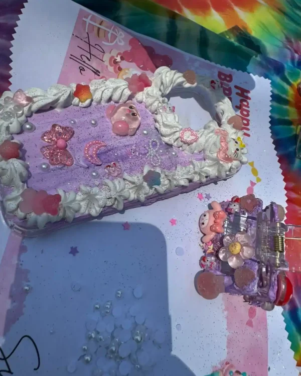 A pastel decorated phone case and accessory with glitter and whipped cream-style details—perfect for adding a whimsical touch to your Extra Large Teepee Rental party or any fun gathering.